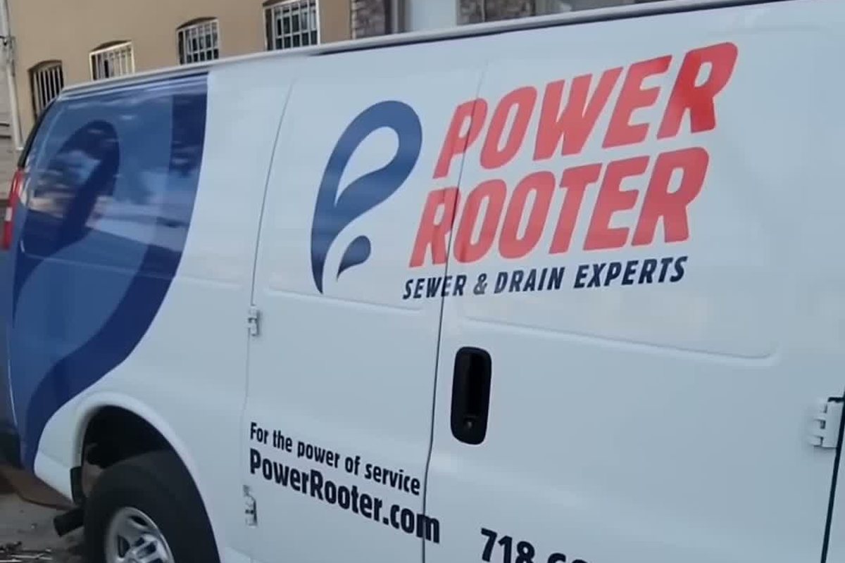 Power Rooter van with the company name and phone number on the side